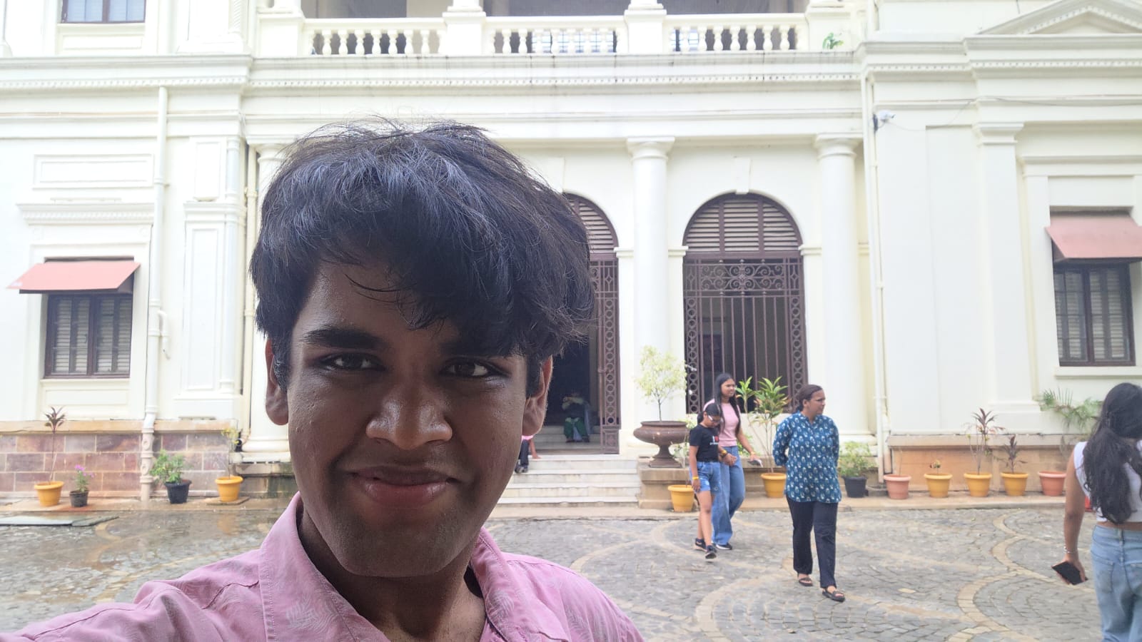 Nitesh at Indore Palace, in front of historic architecture